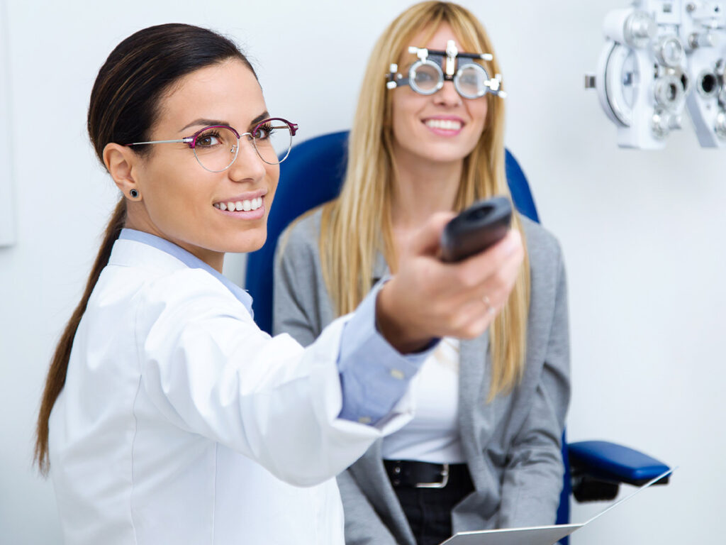 an eye doctor giving a woman an eye exam