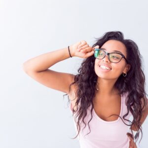 woman with glasses smiling