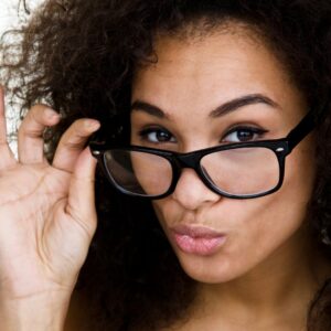 woman looking over her glasses