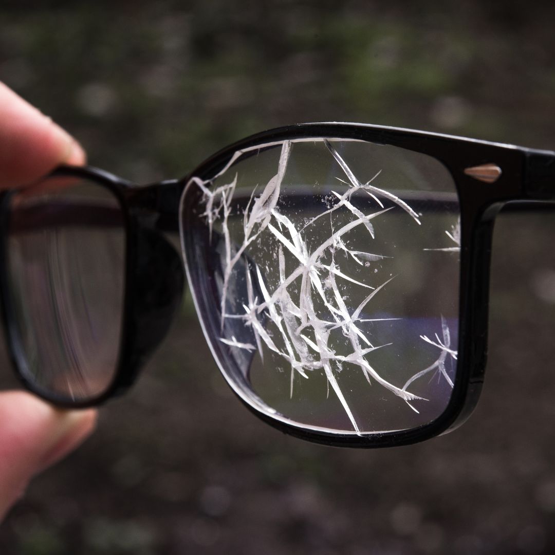 holding broken glasses