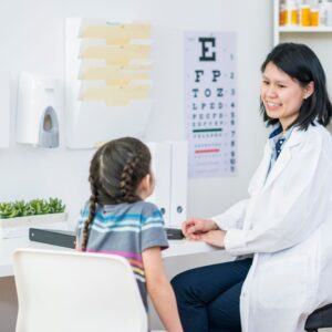 optometrist talking to kid