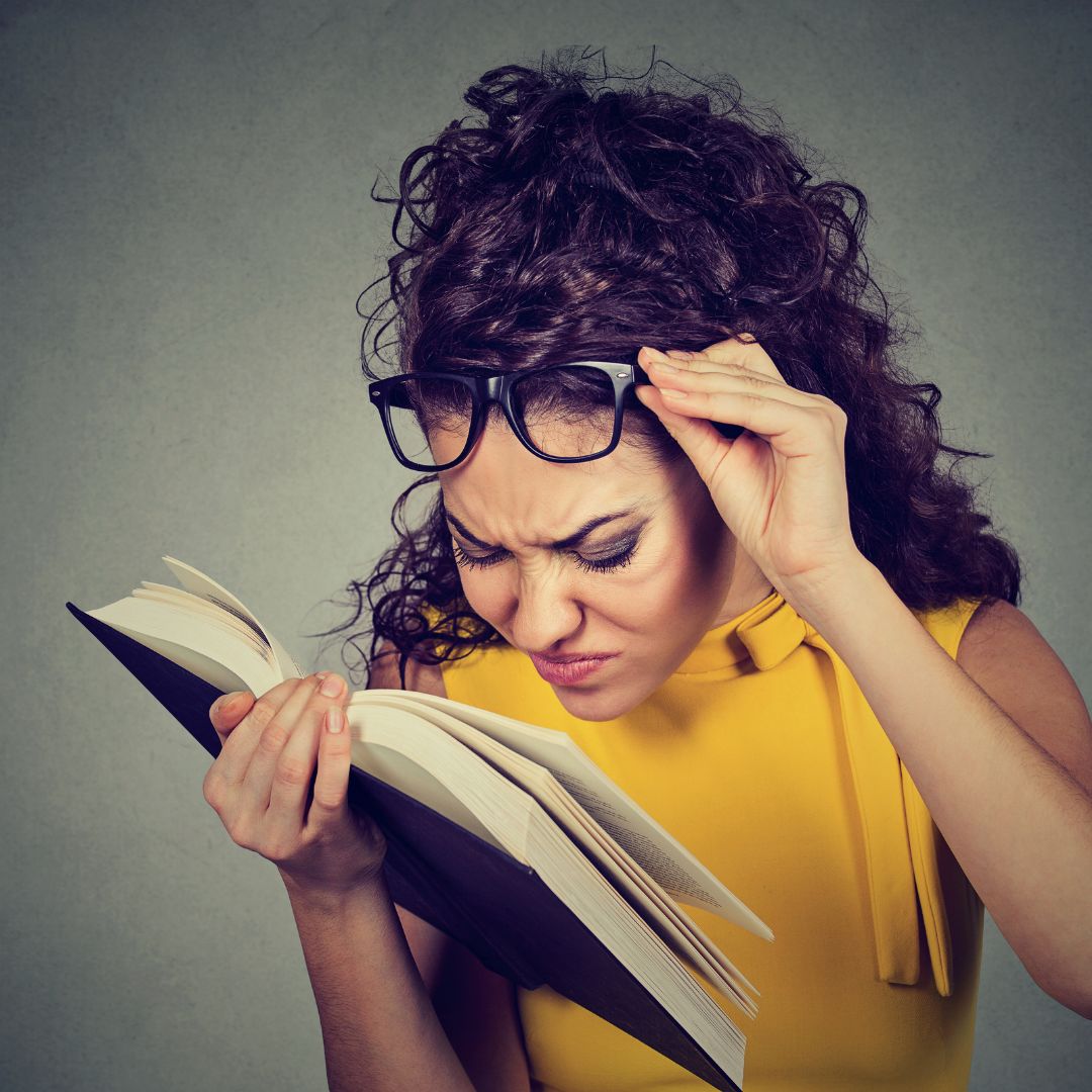 a woman squinting to read